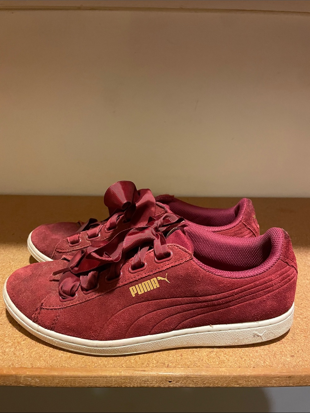 Puma Women’s Suede Sneakers in Wine Red with Gold Logo